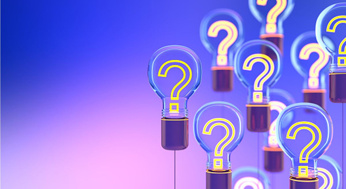 light bulbs with question marks on a blue and pink gradient background